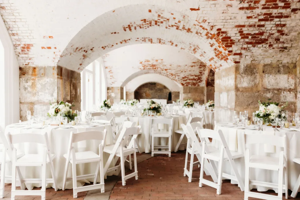A seated reception beneath the vaulted brick arches of the North Casemates